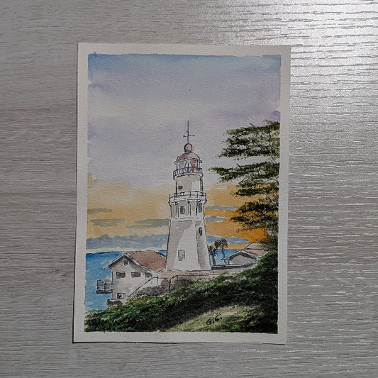 Painting of a lighthouse and house on a textured wall